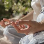 Person meditating in lotus position