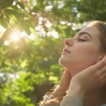 Woman enjoying sunlight in nature